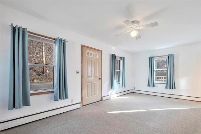 interior space with ceiling fan and a baseboard radiator