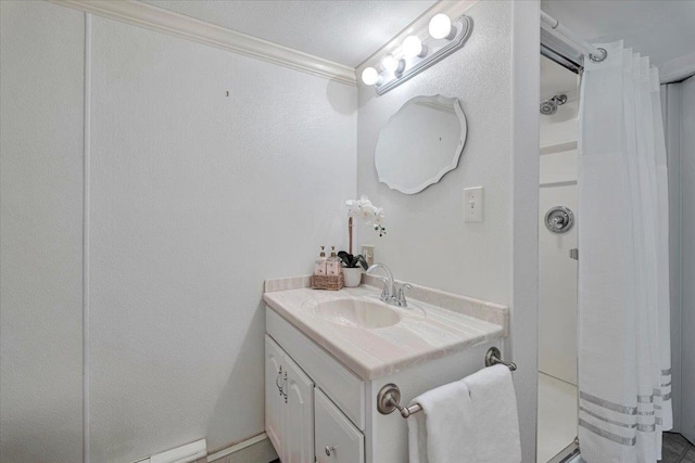 bathroom with vanity, crown molding, and a shower with curtain