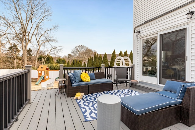 wooden deck featuring an outdoor hangout area and a playground