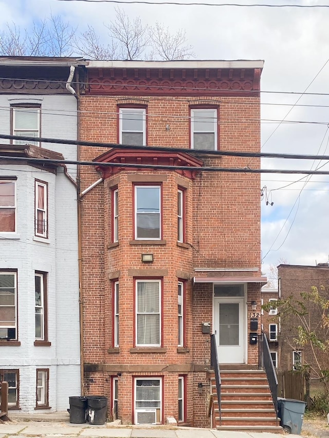 view of front of house with brick siding