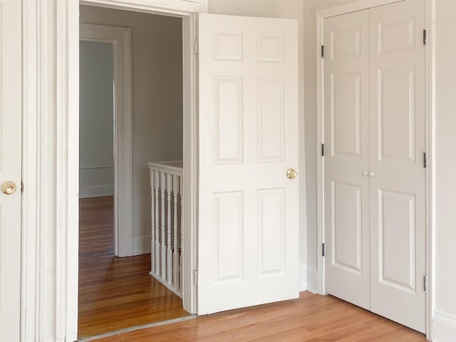 corridor featuring light wood-style flooring