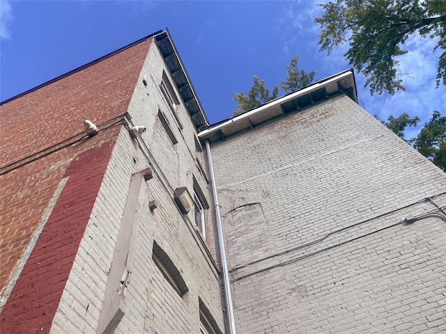 view of side of property featuring brick siding