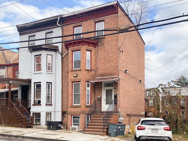 view of front of house with brick siding