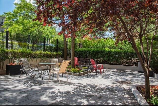 view of patio / terrace featuring fence