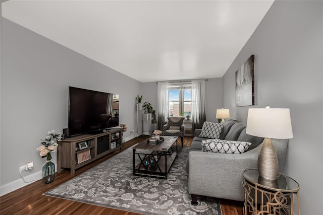 living room with baseboards and wood finished floors