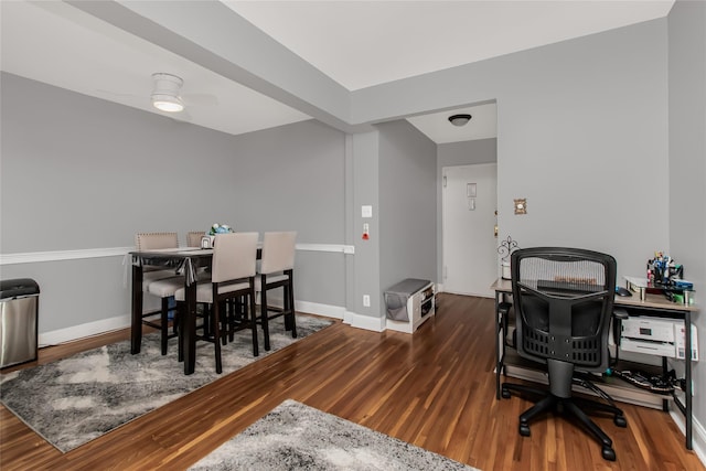 office with ceiling fan, baseboards, and wood finished floors