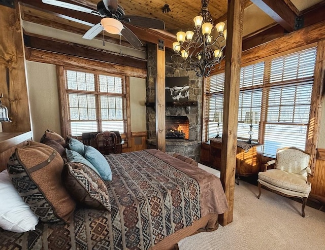 carpeted bedroom featuring wooden ceiling, a fireplace, a chandelier, and beam ceiling