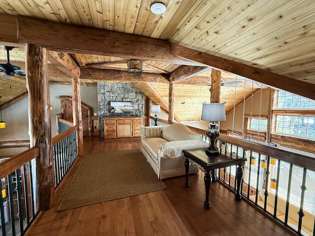 living area with lofted ceiling with beams, wood-type flooring, wood ceiling, and ceiling fan