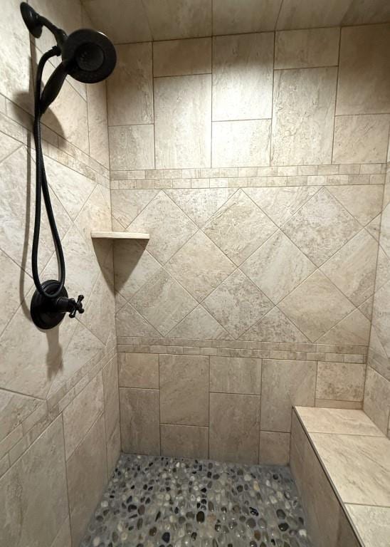 full bathroom with tiled shower