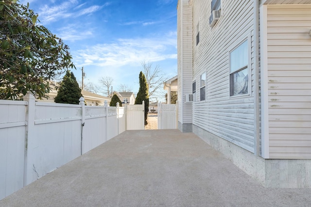 view of patio / terrace with cooling unit and fence