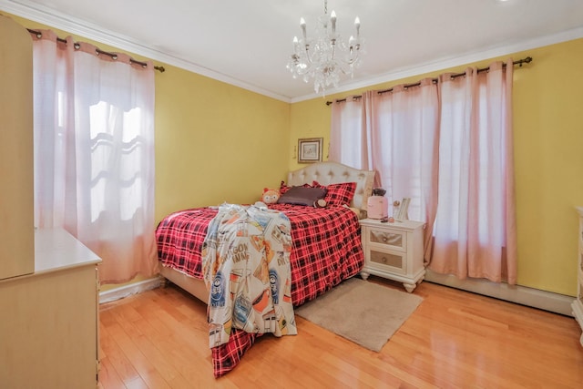 bedroom featuring ornamental molding, a baseboard radiator, wood finished floors, and a notable chandelier