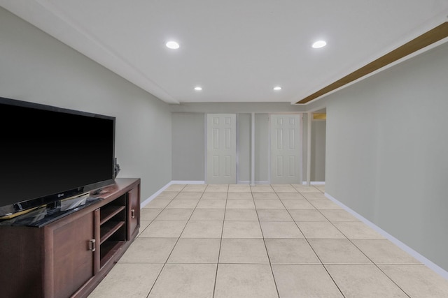 unfurnished living room with light tile patterned floors, baseboards, and recessed lighting