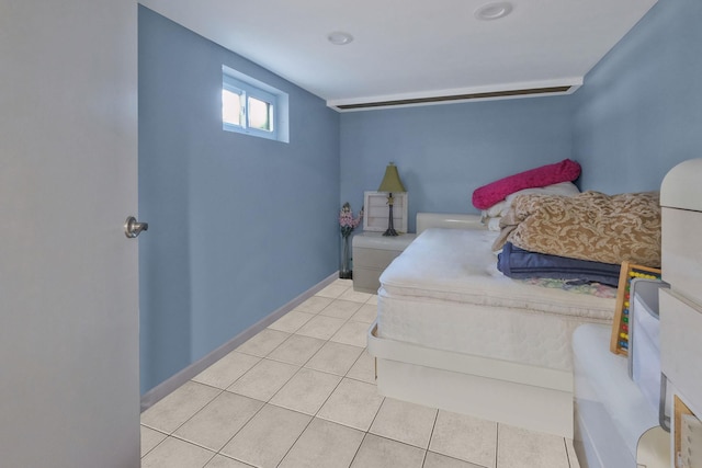 bedroom featuring tile patterned flooring and baseboards