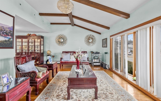 living room featuring a baseboard radiator, vaulted ceiling with beams, and wood finished floors