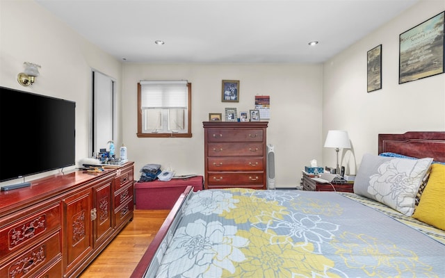 bedroom with recessed lighting and light wood finished floors