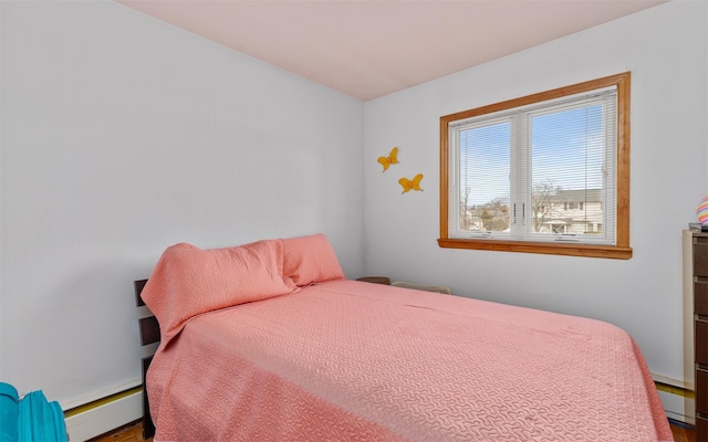 bedroom with a baseboard heating unit