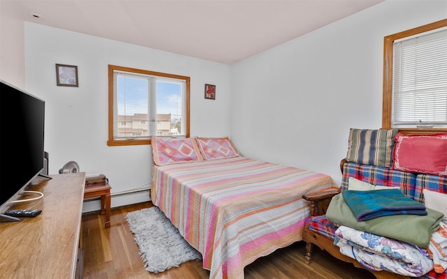 bedroom with wood finished floors