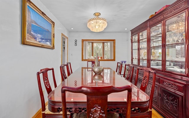 dining space featuring a notable chandelier and recessed lighting