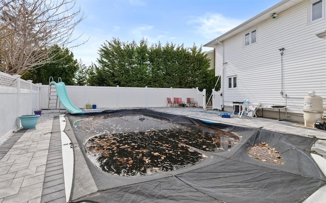 view of pool featuring a patio and a fenced backyard