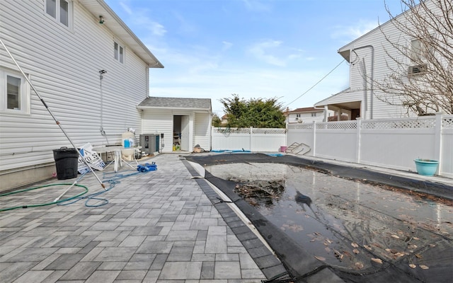 view of patio featuring a fenced backyard and central AC unit