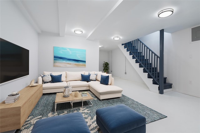 living room with stairway and beamed ceiling