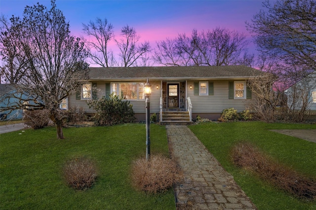 single story home with a front lawn