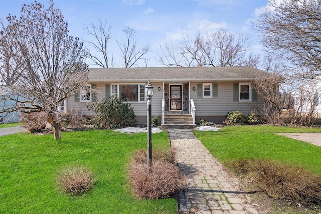 ranch-style house featuring a front lawn