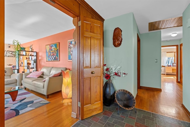 corridor with baseboards and dark wood-style flooring