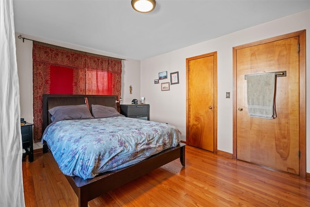 bedroom featuring light wood-style flooring