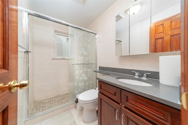 full bath featuring visible vents, toilet, a shower stall, vanity, and tile patterned floors