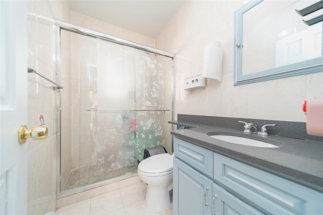 full bath featuring a shower stall, toilet, and tile patterned floors