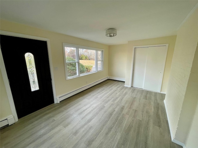 entrance foyer with light wood finished floors and baseboard heating