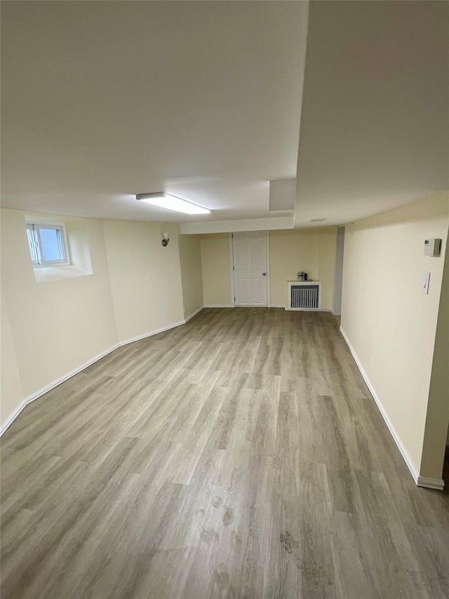 basement with wood finished floors and baseboards