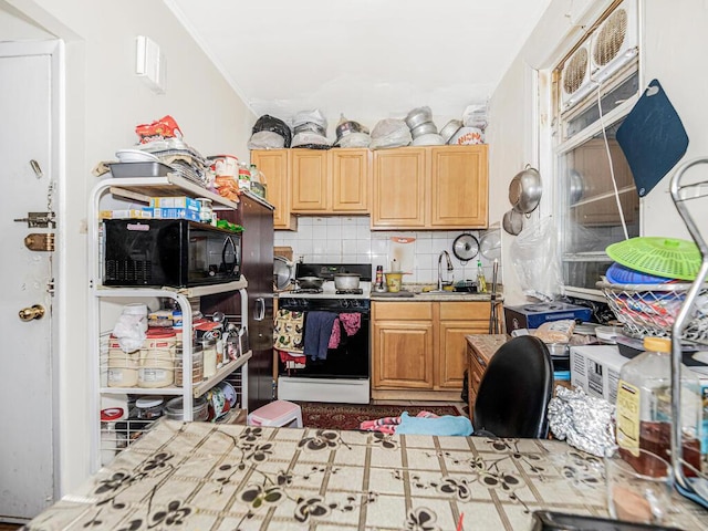 kitchen featuring tasteful backsplash and range with gas cooktop