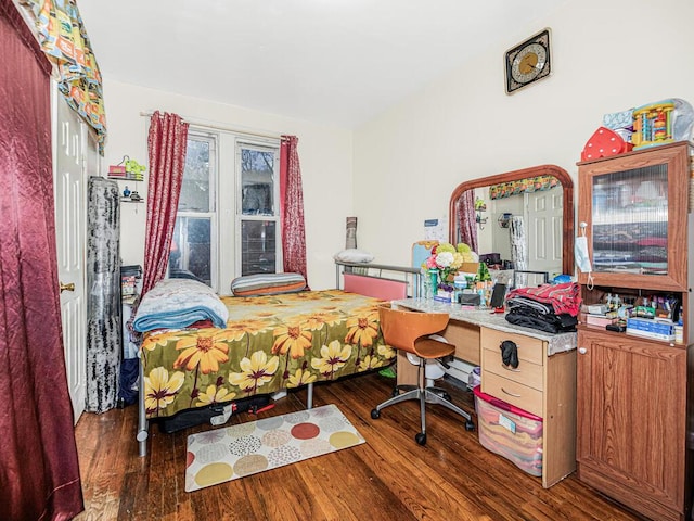 bedroom with wood finished floors