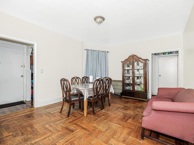 dining area with baseboards and radiator heating unit