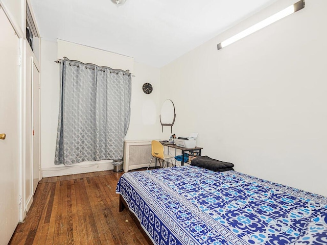 bedroom with hardwood / wood-style flooring