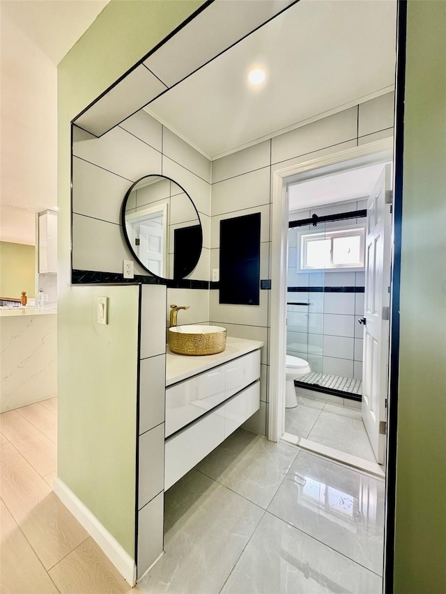 full bathroom featuring tile patterned flooring, toilet, and vanity