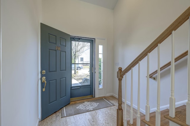 foyer with stairway and light wood-type flooring