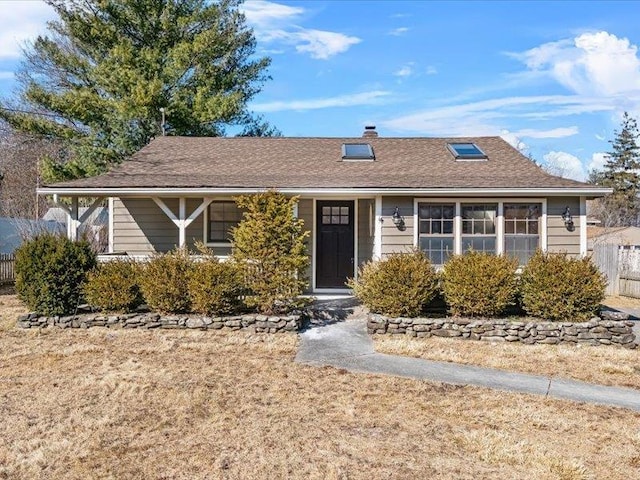 ranch-style house with fence