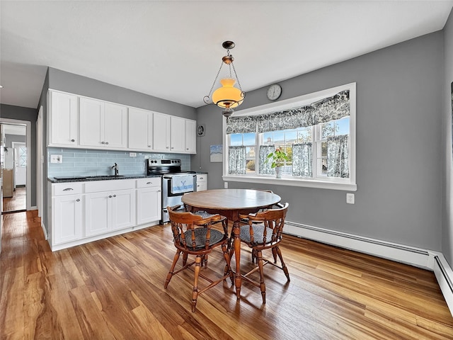 dining area featuring light wood finished floors