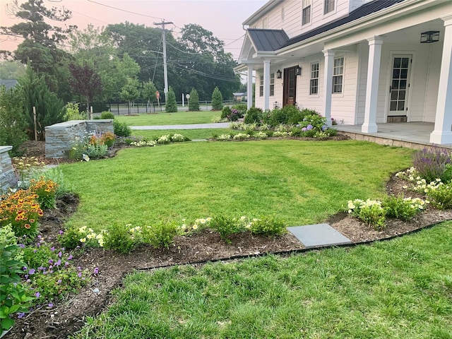 view of yard featuring a porch