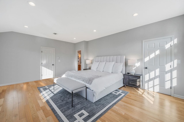 bedroom featuring light wood finished floors, visible vents, and recessed lighting