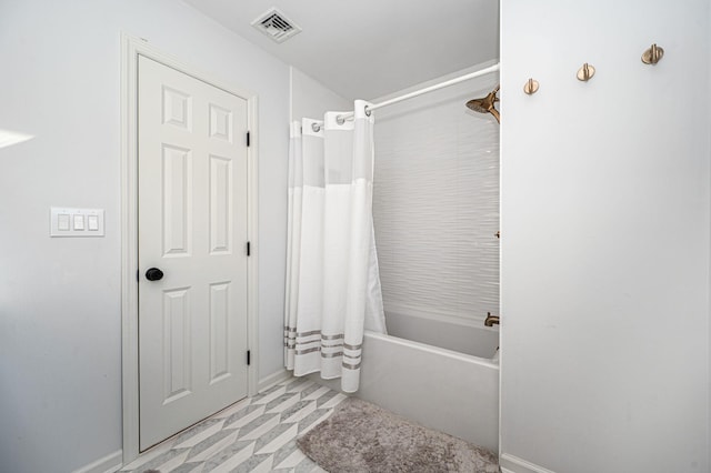 bathroom featuring shower / tub combo and visible vents