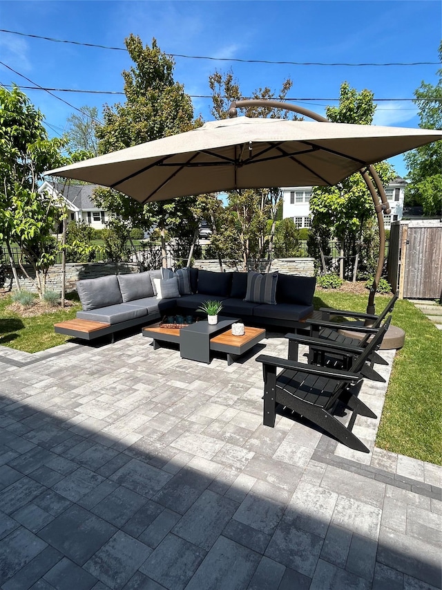 view of patio / terrace featuring an outdoor hangout area and fence