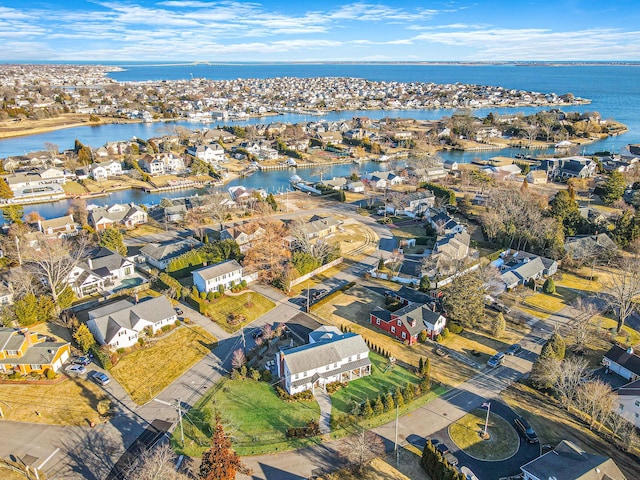 bird's eye view with a residential view and a water view