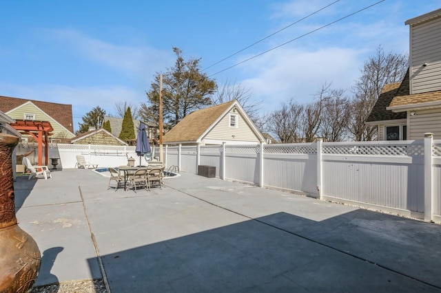 view of patio featuring outdoor dining area and a fenced backyard