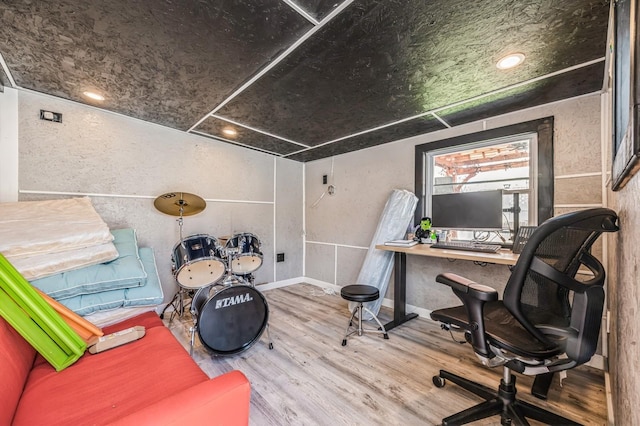 office space featuring baseboards and wood finished floors