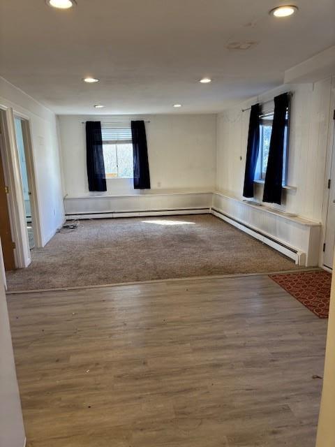 empty room featuring wood finished floors and recessed lighting