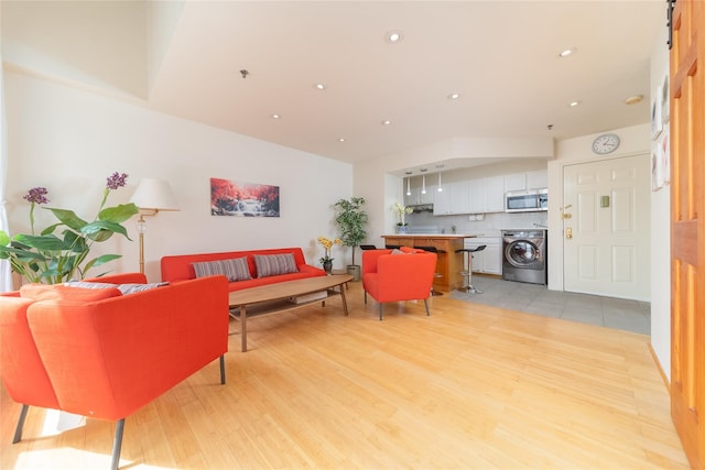 living area with light wood-style floors, recessed lighting, and washer / clothes dryer